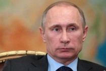 Putin denies sending Russian troops to Crimea