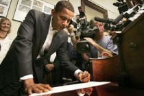 Barack Obama signs his stimulus plan into law