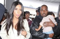 Kim Kardashian returns to her roots with long hair for trip with Kanye West and sleepy North