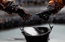 Oil eases, but Iran sanctions keep prices near late 2014 highs