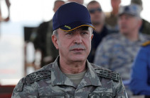 Near Syrian border, Turkish defense minister vows operation when time is right