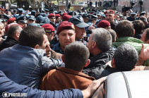 Participant of protest action taken to police department after clashes between Spayka company employees and police