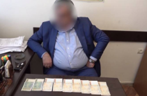 NSS arrests official for taking bribe