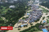 China rains: Thousands stranded after record downpour