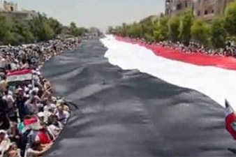 2 km long flag in defence of Syrian President 