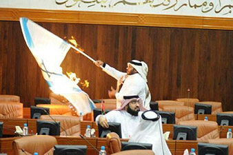 Bahrain lawmaker sets fire to Israeli flag