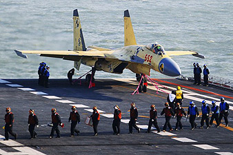 China announced Sunday that it had landed a fighter jet on deck