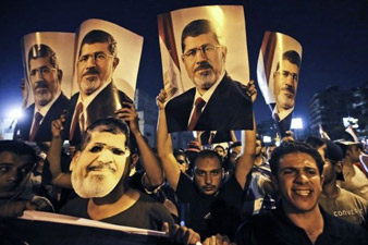 Supporters of ousted President Mohammed Morsi call for marches after Friday