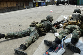 Death toll climbs as army, militants fight on in the Philippines