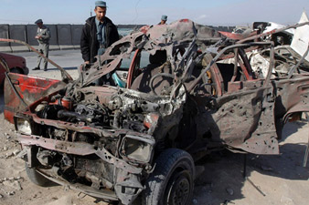 Suicide bomber explodes car, killing 2 Afghan police officers