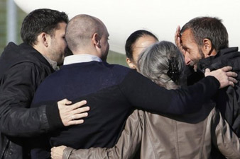 French hostages home amid ransom claim