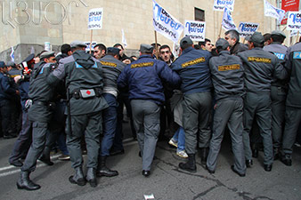 Protesters try to block street at Finance Ministry 