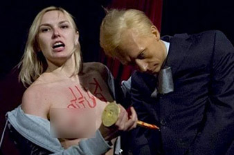 Femen activists stage topless ‘blood bucket challenge' against Putin 