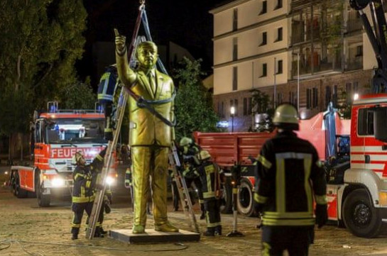 German city removes gold Erdoğan statue after violent clashes